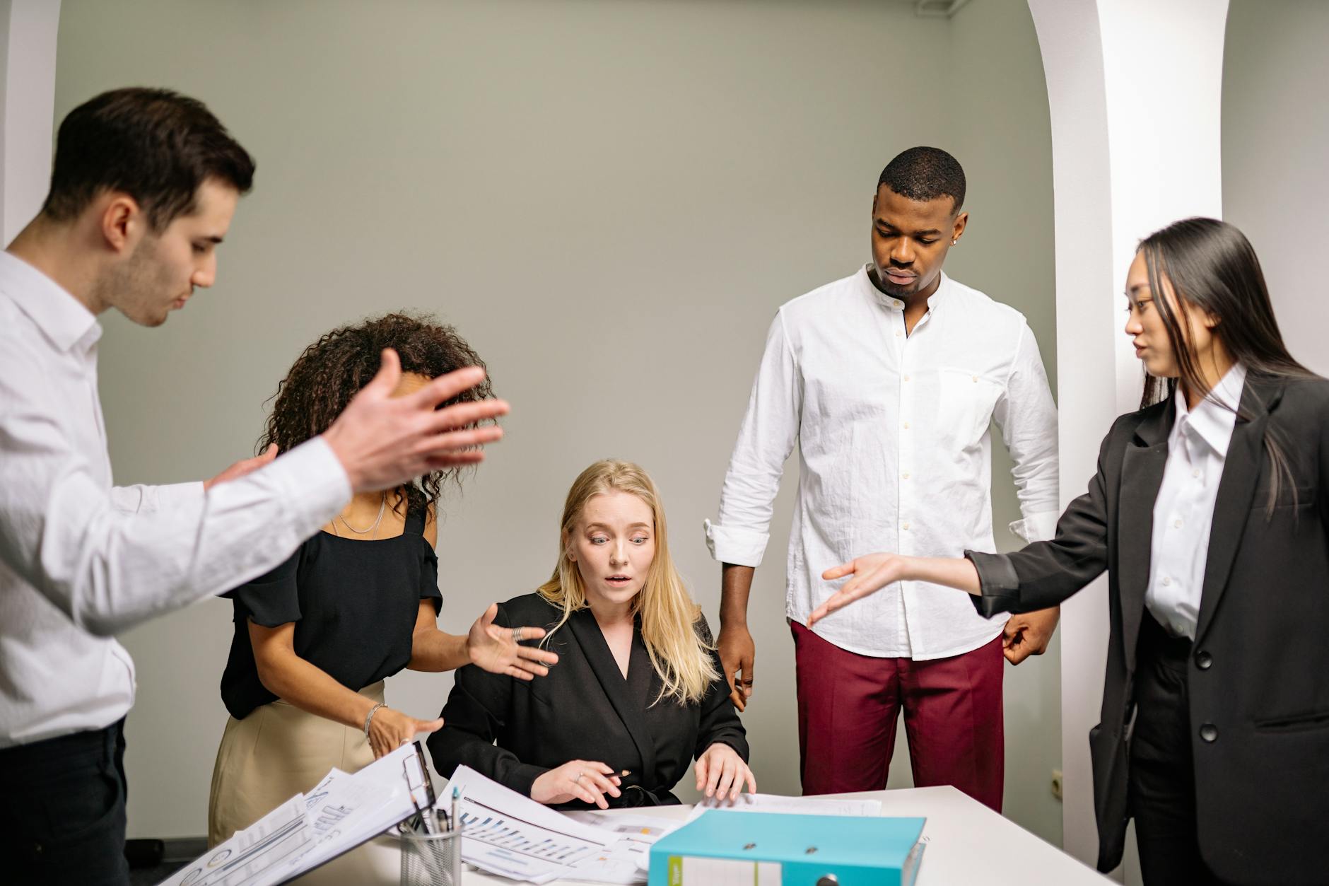 Business professionals in a modern office meeting room discussing employee benefits and retention strategies
