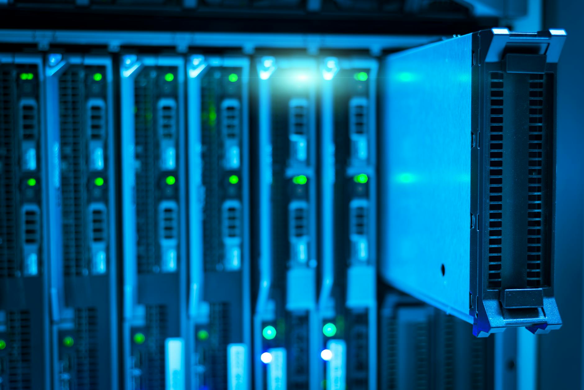 Rows of servers in a modern data center facility with extensive cabling and cooling systems