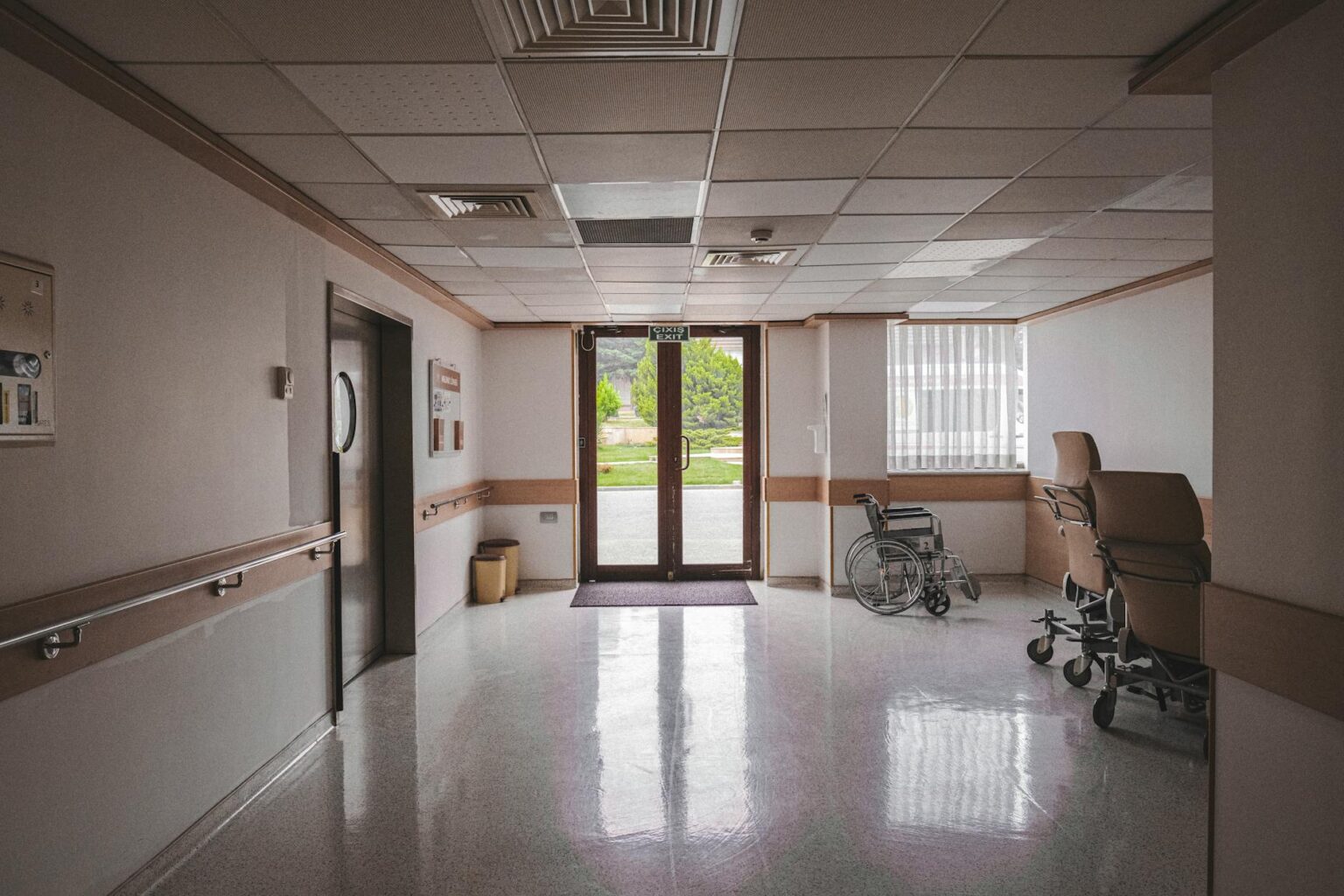 How Rising Healthcare Costs Are Driving Medical Tourism Investment Growth Modern hospital hallway with clean white walls and medical equipment
