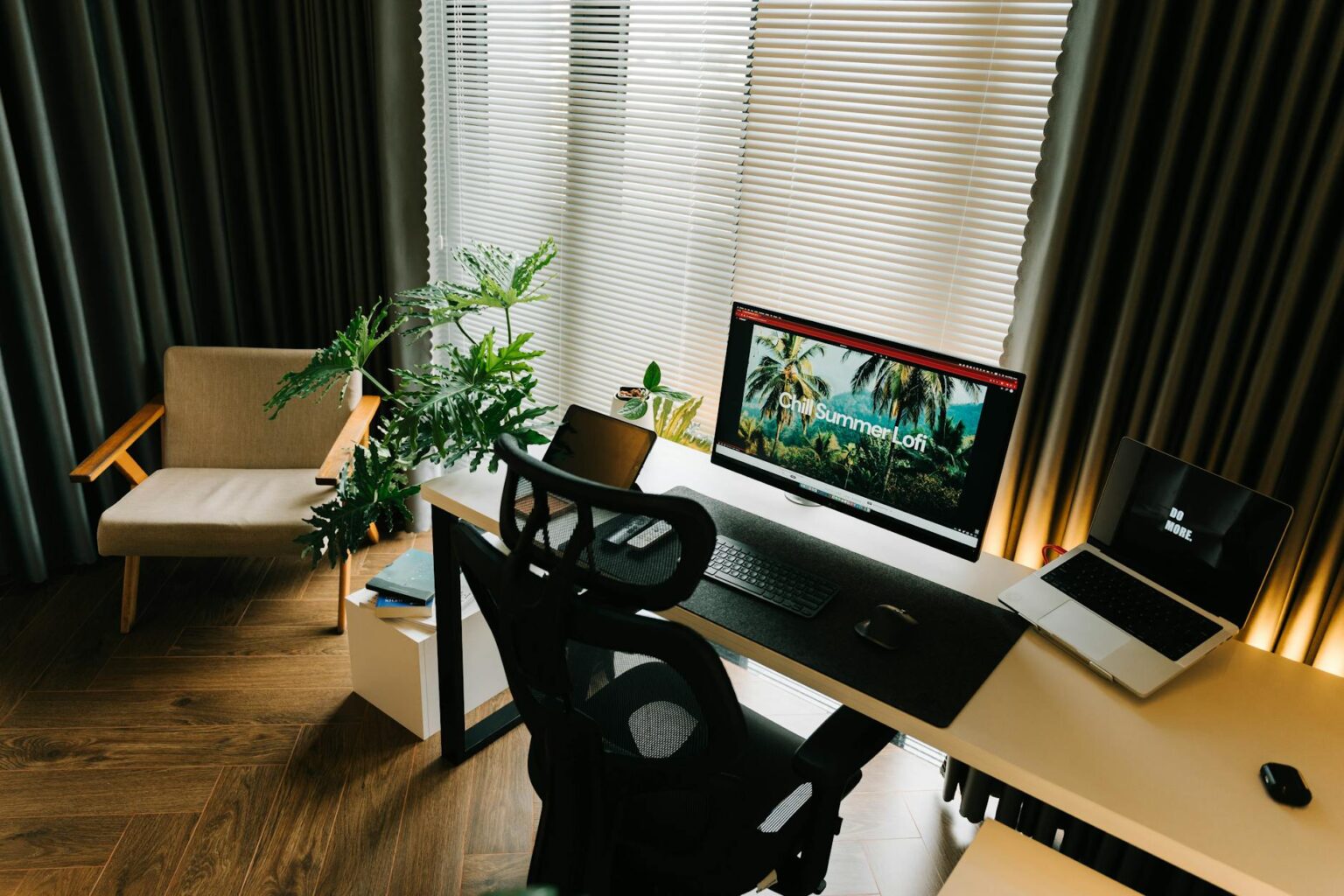 Why Corporate Remote Work Stipends Are Replacing Office Space Investments Modern home office workspace with laptop, monitor, and ergonomic chair showing remote work environment