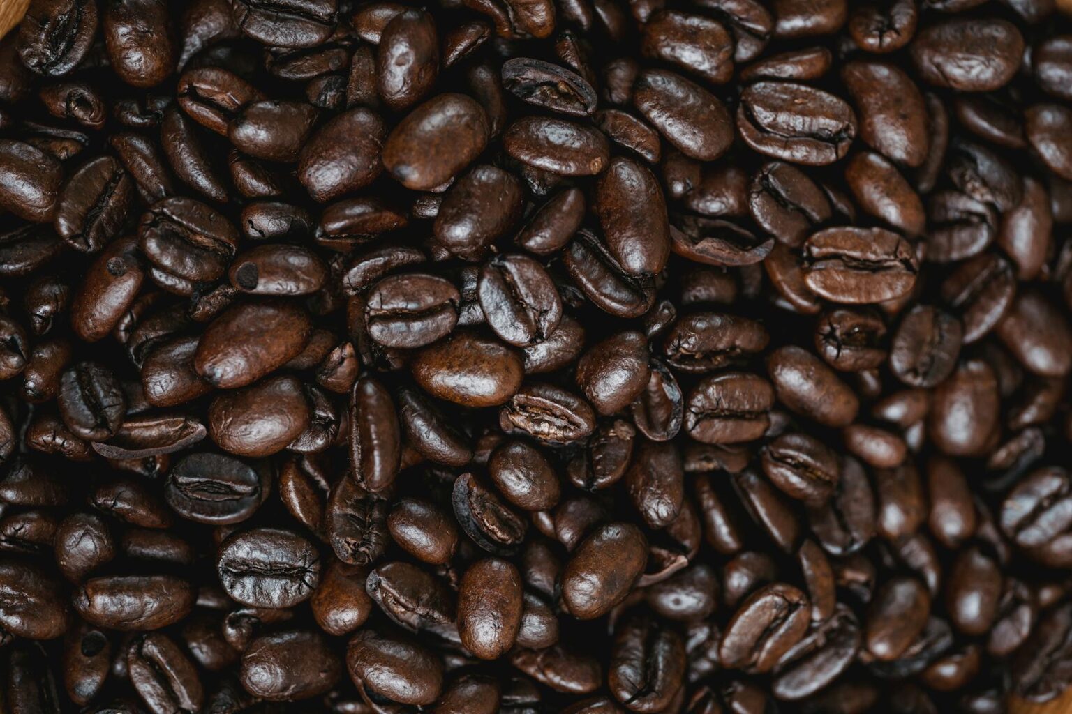 How Rising Coffee Bean Prices Are Driving Cafe Subscription Model Adoption Close-up view of roasted arabica coffee beans showing texture and color variations