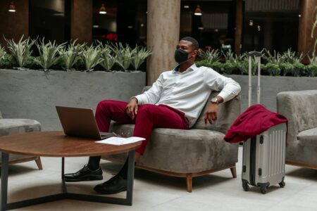 Modern hotel lobby with contemporary furniture and open workspace areas