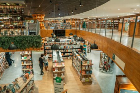 Interior of modern bookstore with shelves and reading areas