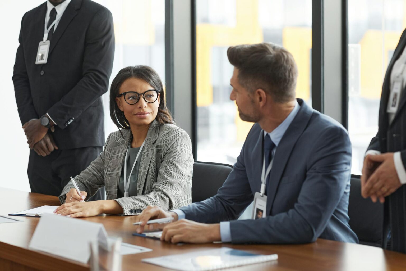 Why Corporate Apprenticeship Programs Are Replacing MBA Recruitment Pipelines Professional business meeting with diverse team discussing strategy around conference table