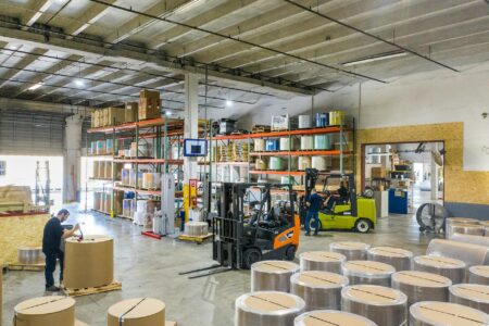 How Major Department Stores Are Converting Floors Into Fulfillment Centers Modern warehouse interior with storage shelves and organized inventory systems
