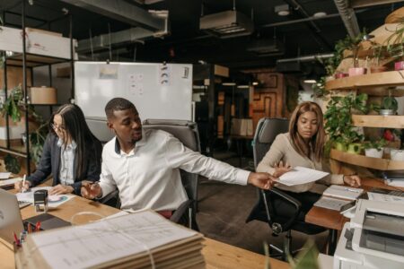 Why Corporate Employee Sabbatical Programs Are Reducing Turnover Costs Modern corporate office space with employees working at desks