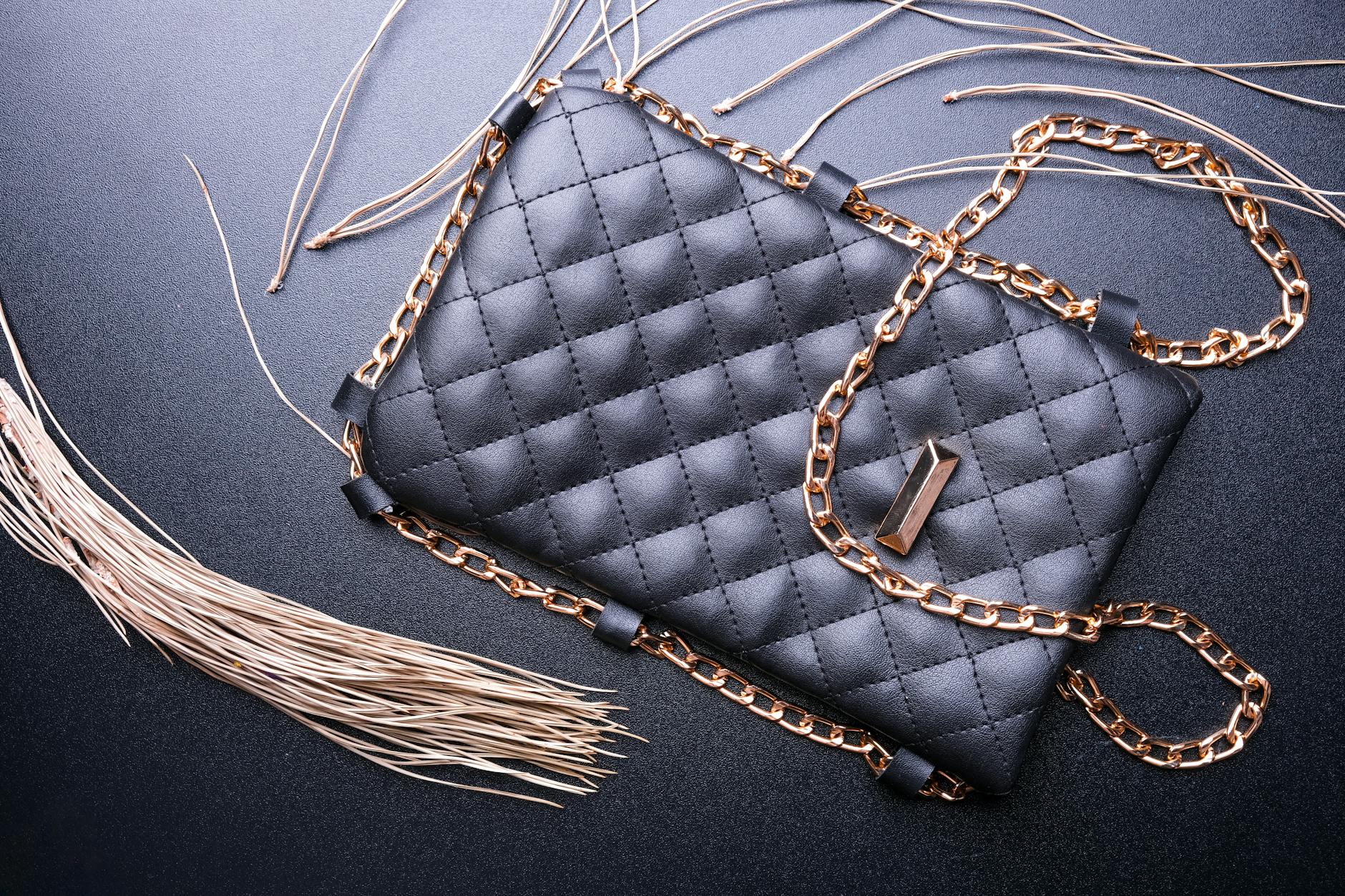 Elegant luxury handbag displayed on marble surface showing premium craftsmanship and materials