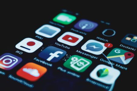 How Subscription Service Cancellations Are Reshaping Consumer Spending Habits Close-up of smartphone screen showing various subscription app icons