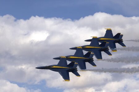 Why Defense Contractor Stocks Are Surging Amid Global Tensions Military aircraft on tarmac representing defense industry growth and military modernization investments