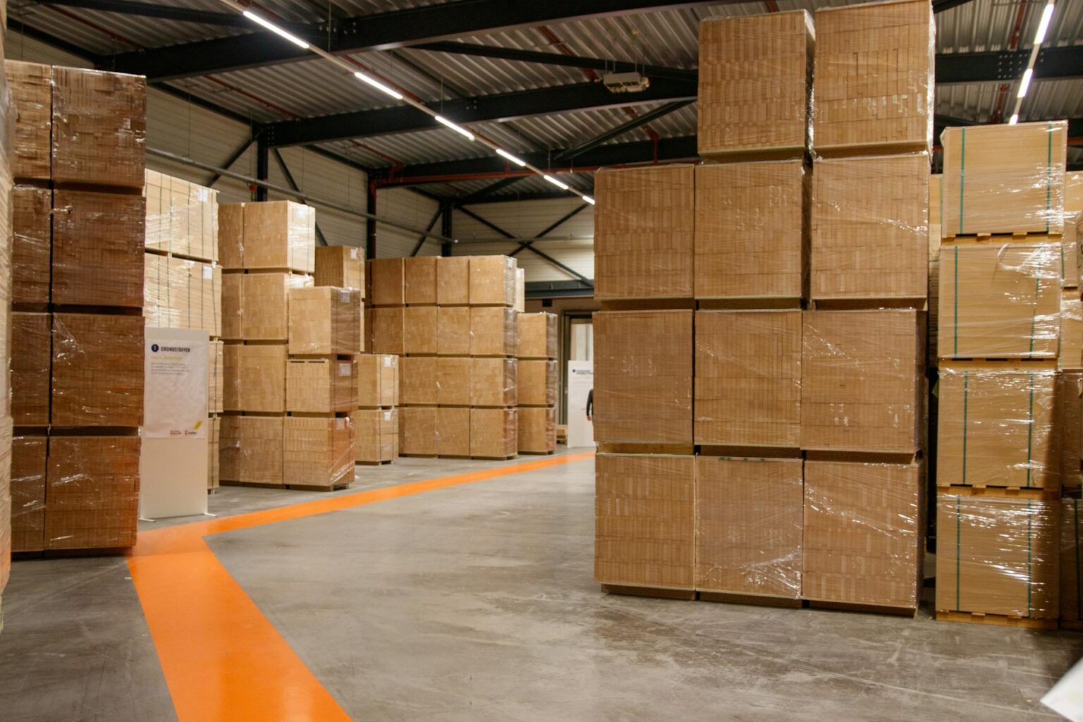 The Hidden Costs of Free Shipping Are Reshaping E-commerce Warehouse interior filled with shipping boxes and packages ready for delivery