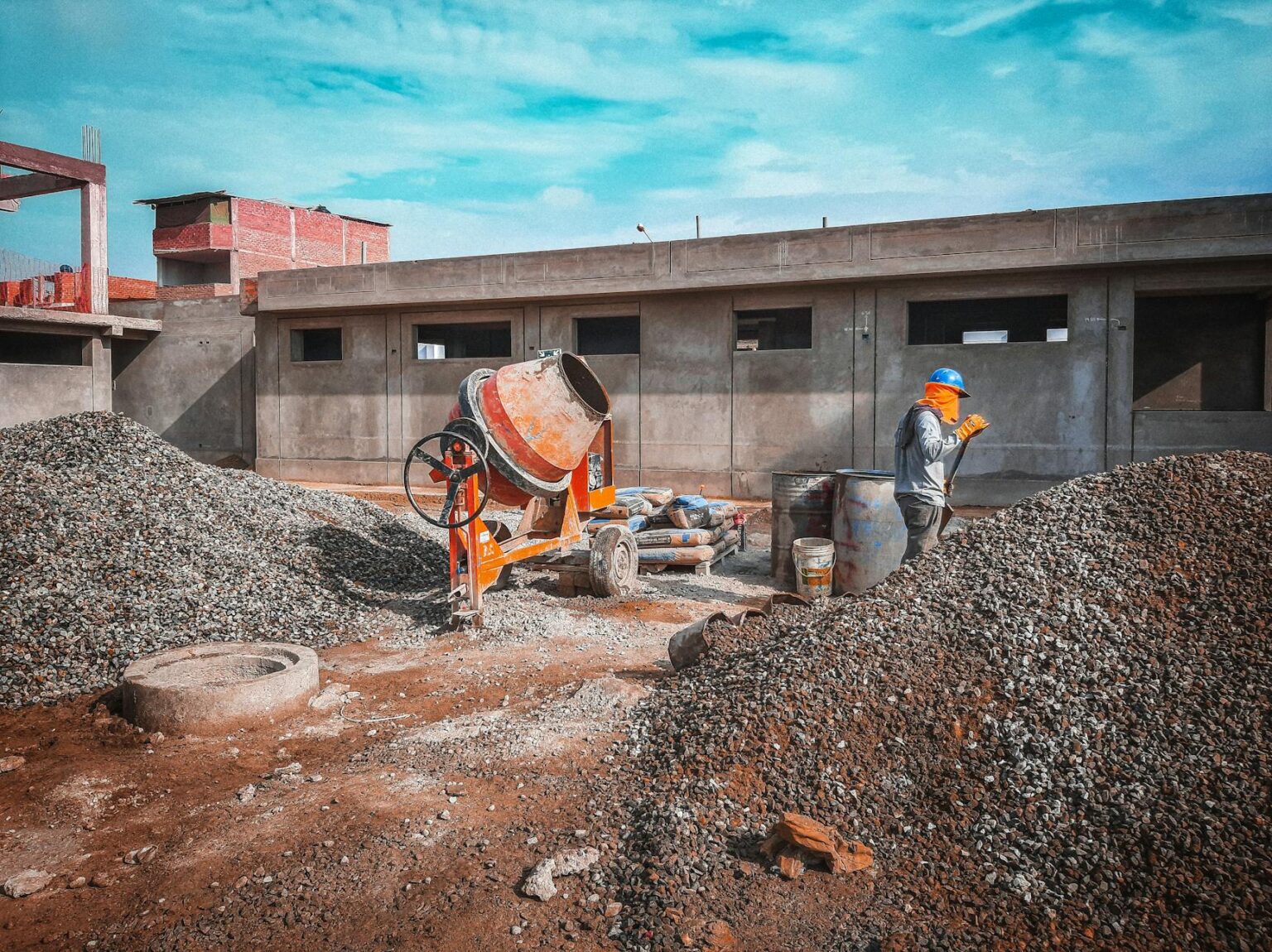 The Economic Impact of Major League Soccer’s Rapid Stadium Expansion Construction workers building stadium infrastructure with cranes and equipment visible