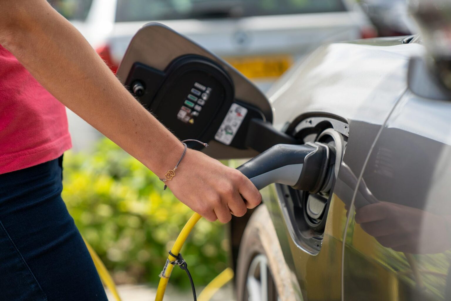 Why Electric Vehicle Charging Networks Are Attracting Infrastructure Investment Electric vehicle connected to charging station with power cable