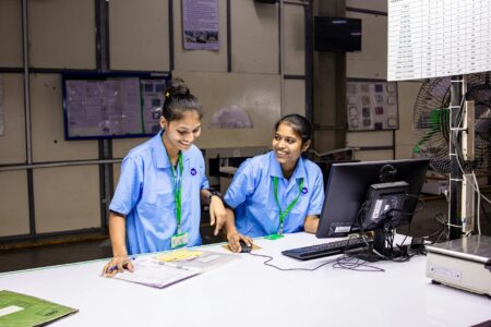 How Corporate Childcare Benefits Are Reducing Employee Turnover Costs Professional employees working in modern office environment