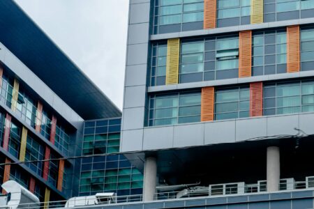 Why Flexible Work Arrangements Are Reshaping Office Lease Negotiations Modern office building exterior with glass facade and urban setting