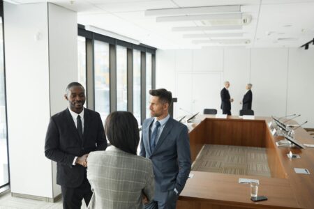 Diverse group of business professionals in a modern conference room during an executive meeting
