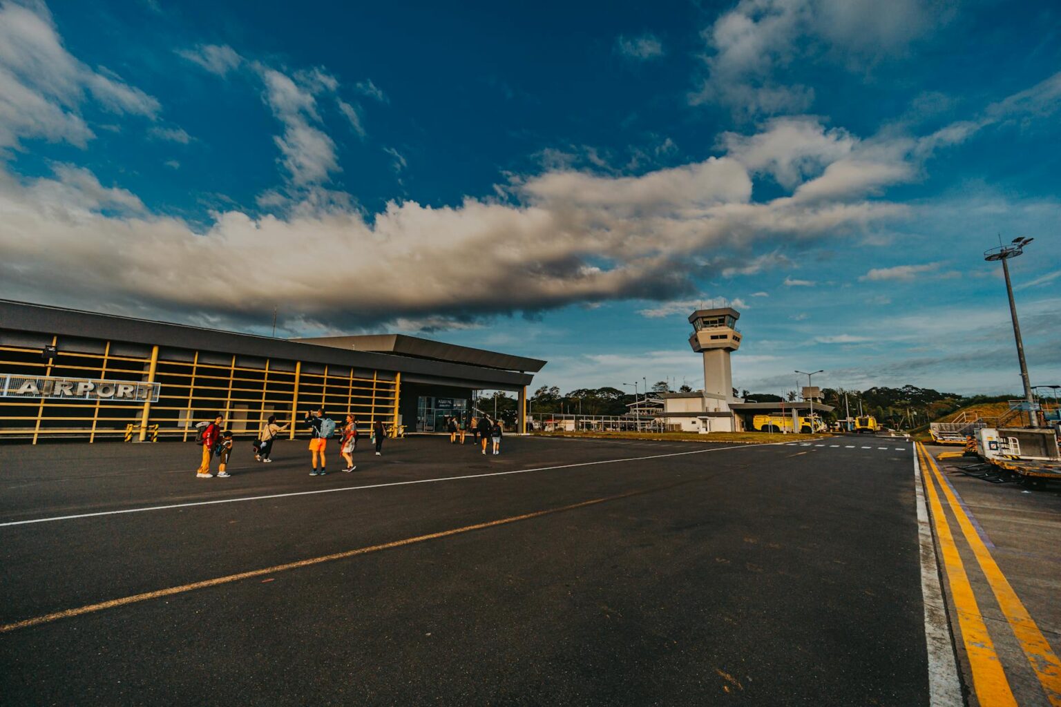 Why Corporate Travel Budget Cuts Are Boosting Regional Airport Revenue Strategies Empty runway at regional airport with control tower in background