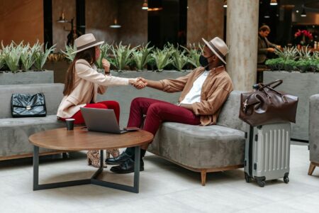 Modern hotel lobby with seating areas and reception desk