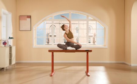 Modern office space with wellness amenities including plants and ergonomic furniture