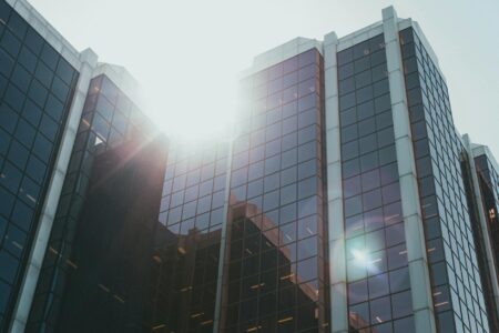 Why Corporate Name Changes Are Signaling Industry-Wide Pivots Modern corporate office building exterior with glass facade representing business transformation