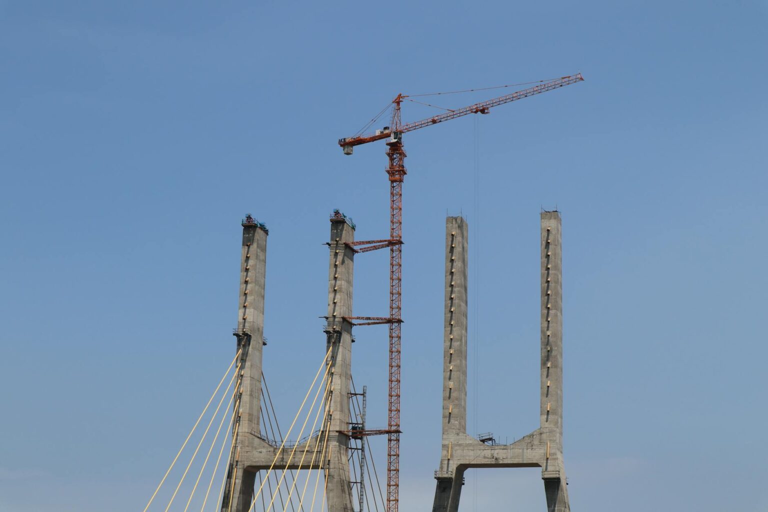 Why Infrastructure Bonds Are Attracting Pension Fund Investments Construction workers building infrastructure bridge project representing pension fund investment opportunities