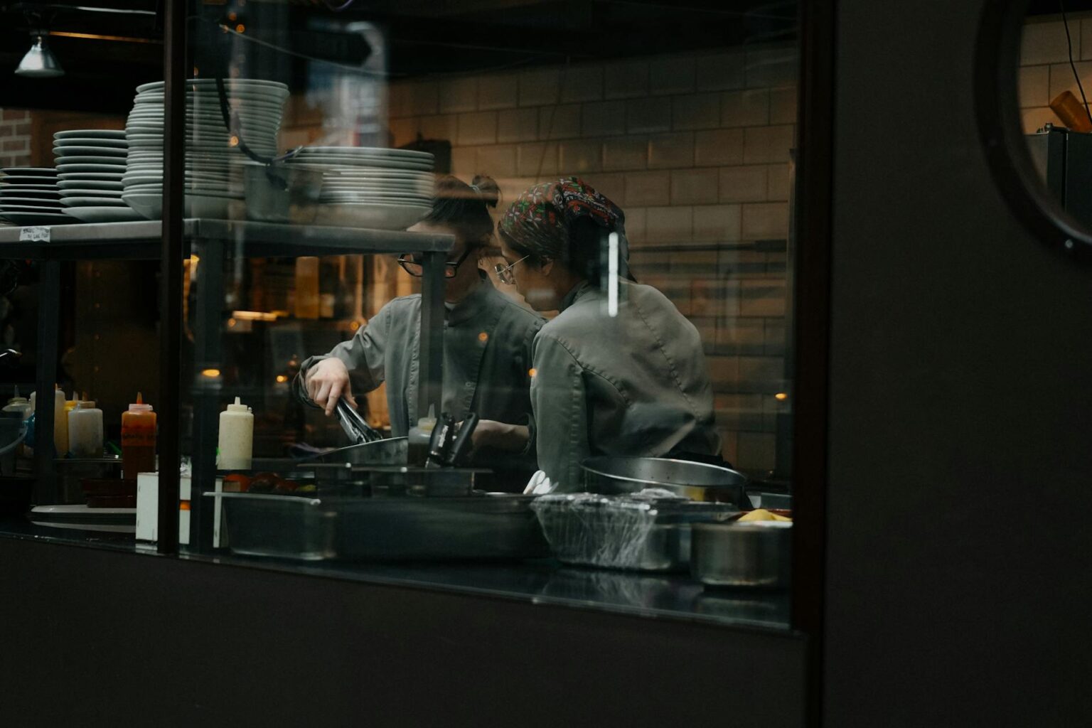 Why Food Delivery Apps Are Investing in Restaurant Kitchen Equipment Professional restaurant kitchen with modern cooking equipment and stainless steel appliances
