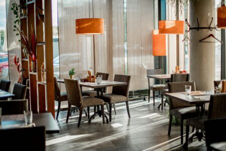 How Celebrity Restaurant Investments Are Reshaping Food Service Valuations Modern restaurant interior with elegant dining setup and ambient lighting