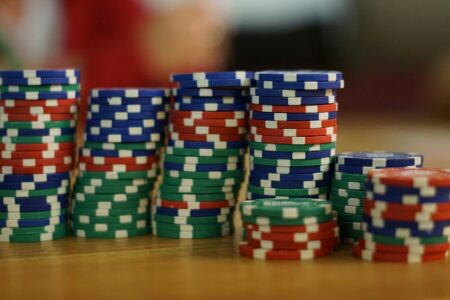 How Casino Expansion Into Sports Betting Is Boosting Gaming Stocks Casino chips and cards representing traditional gambling shifting toward sports betting integration