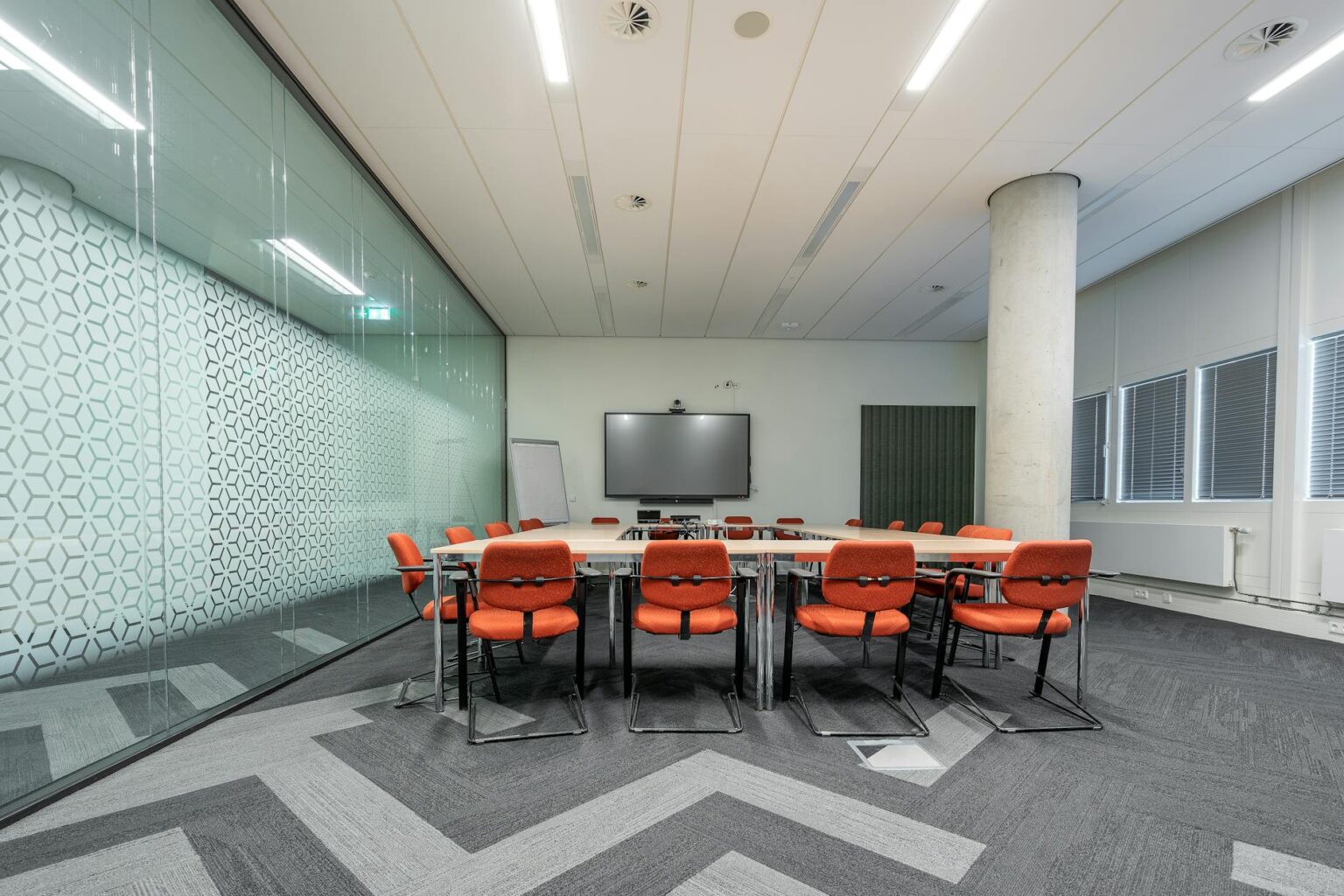 Why Corporate Stock Buybacks Are Declining Amid Rising Interest Rates Modern corporate boardroom with conference table and chairs where executives make capital allocation decisions