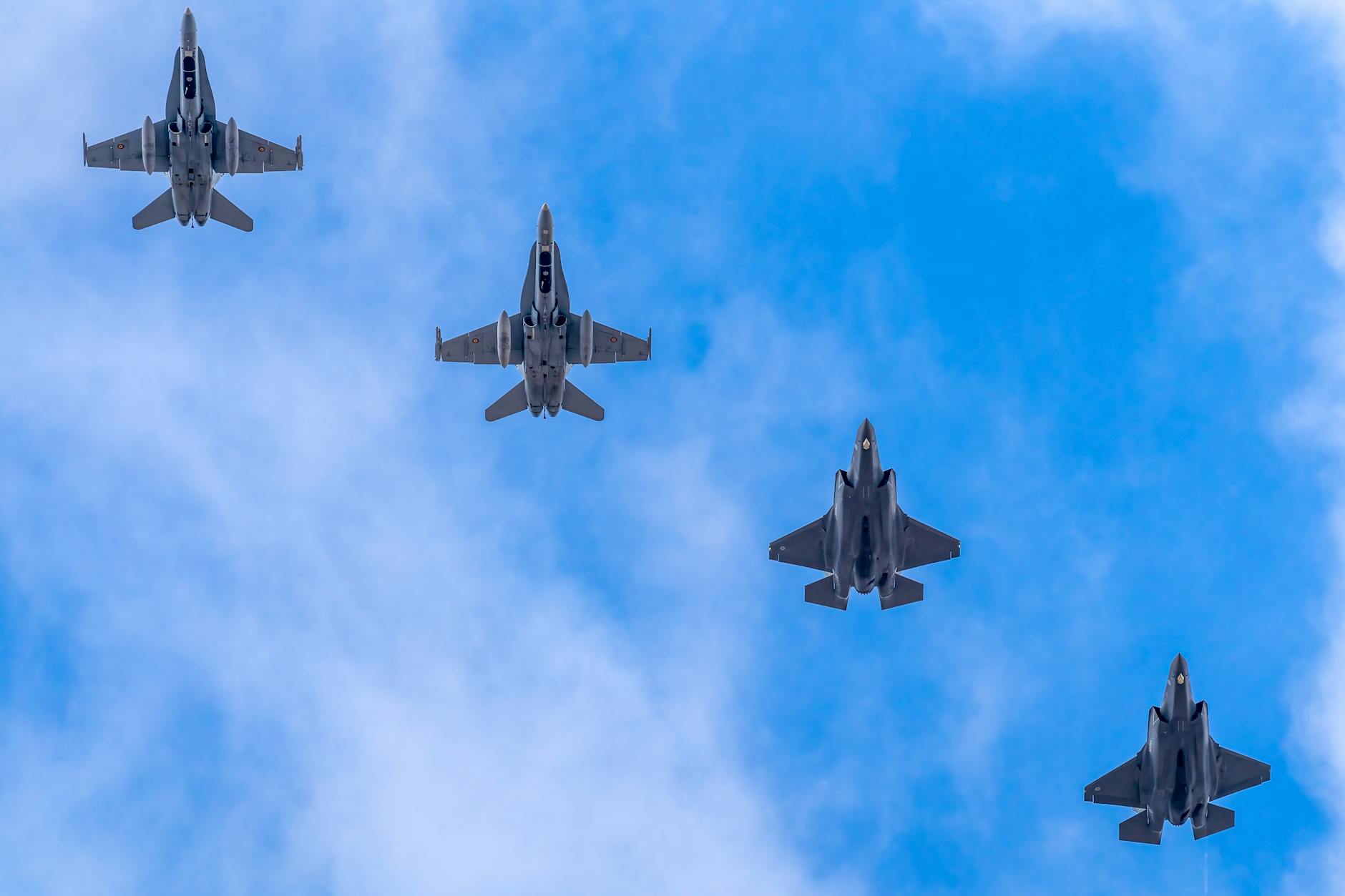 Modern fighter jets on military airfield representing defense contractor manufacturing