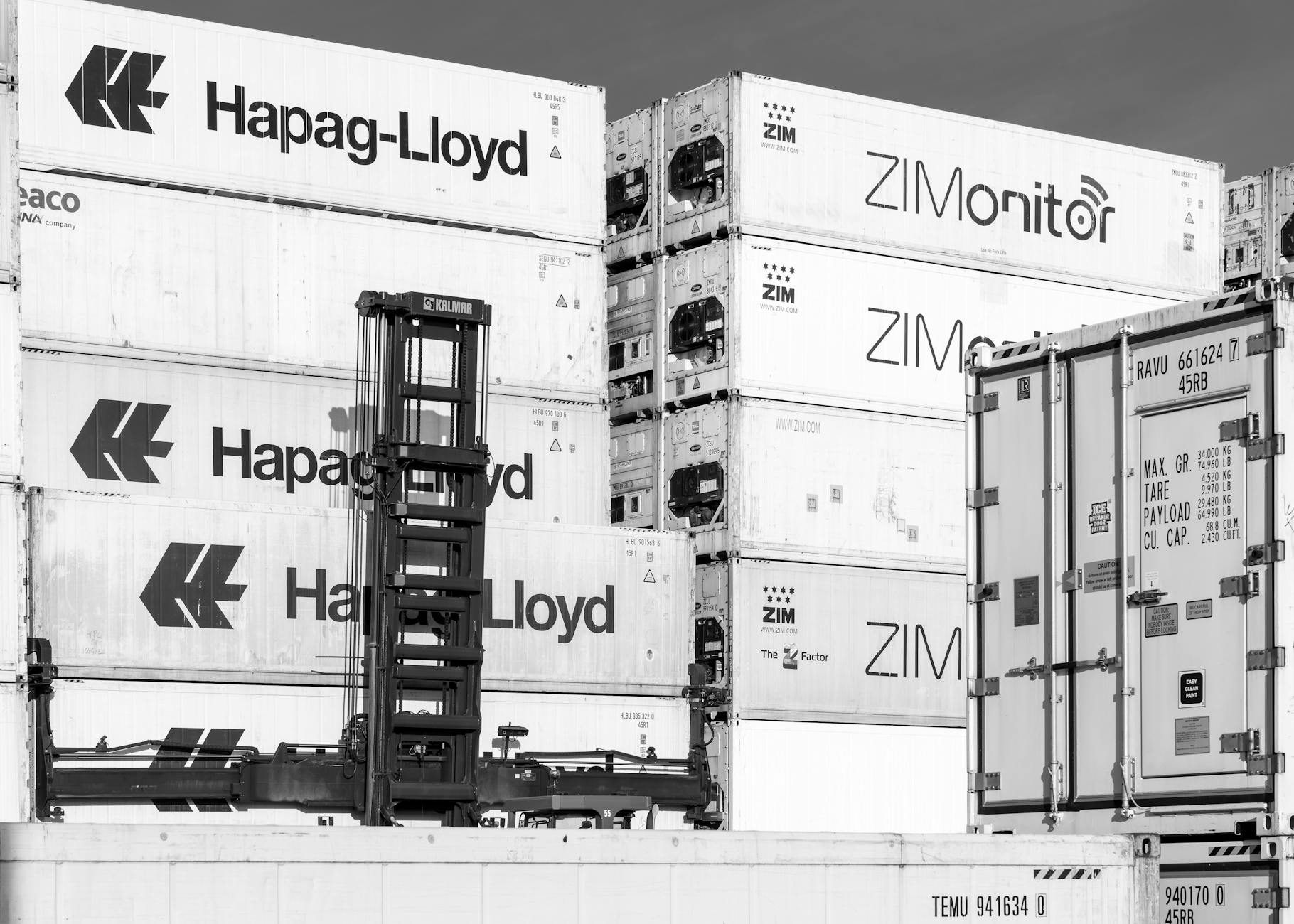 Cargo containers stacked at shipping port terminal