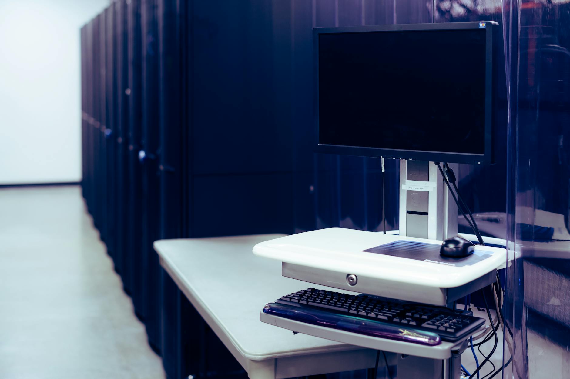 Rows of computer servers in a data center showing the infrastructure that replaces traditional office equipment
