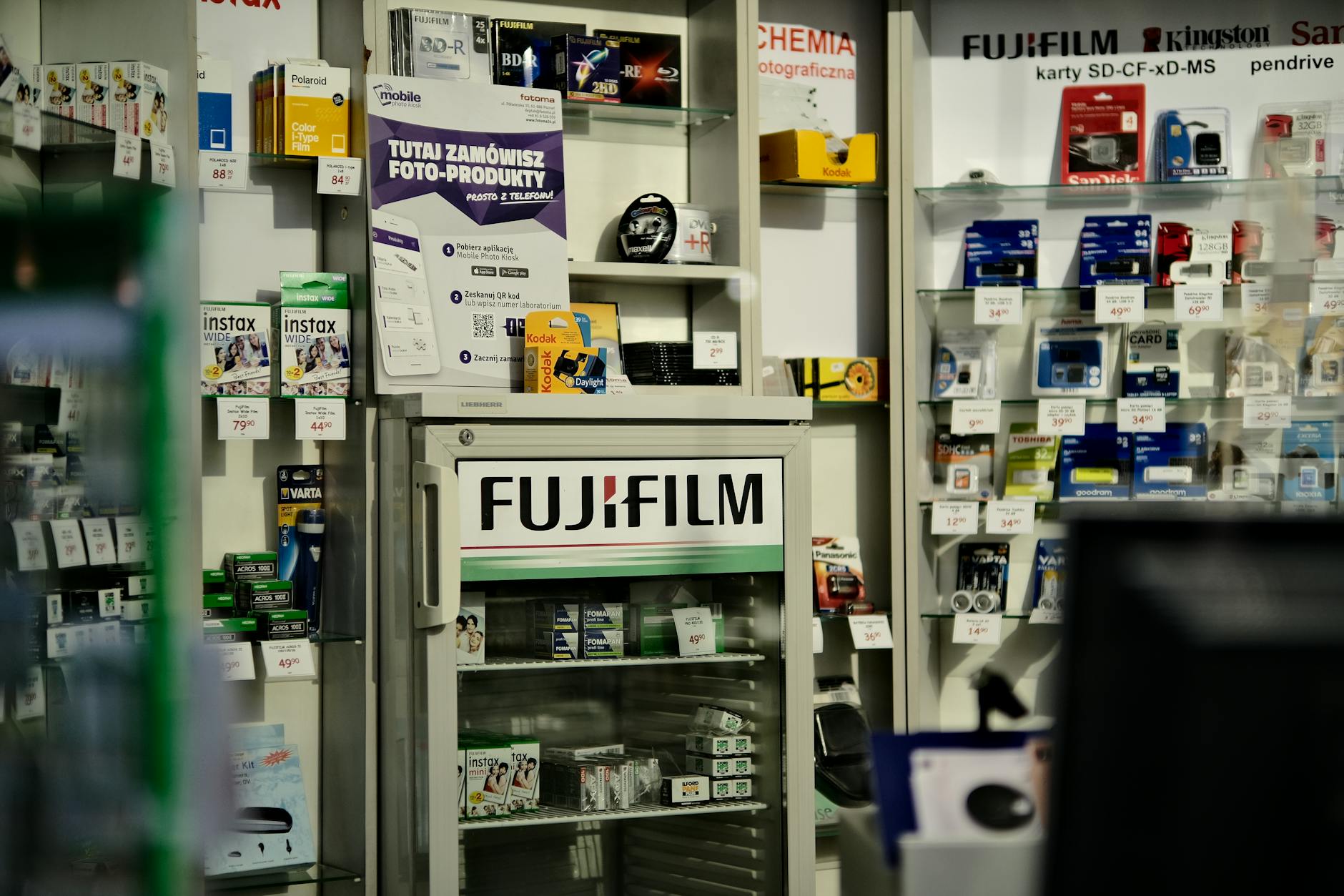 Electronics display in modern retail store showing various devices