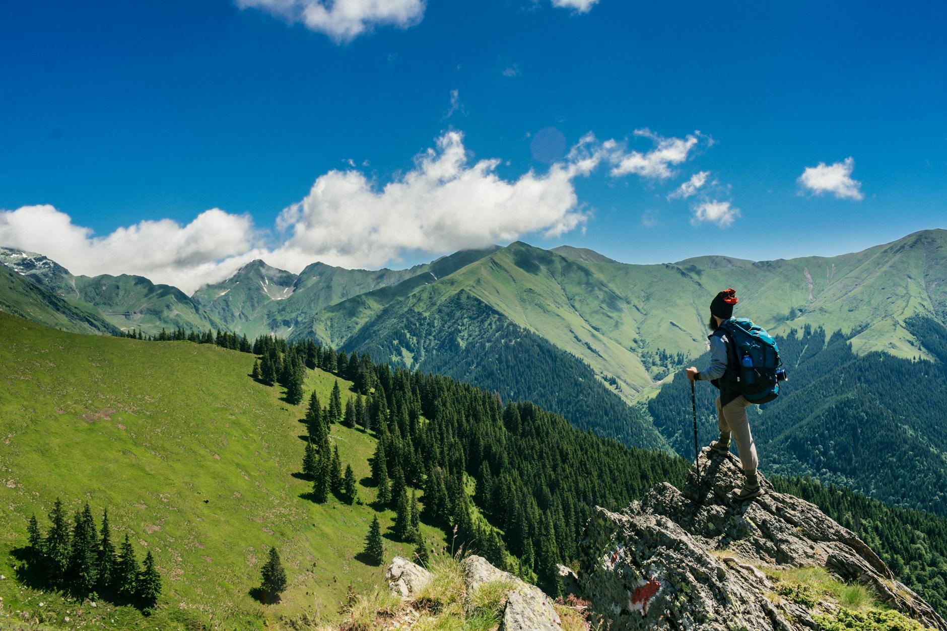 Professional taking a sabbatical break hiking in mountain landscape for personal renewal and development