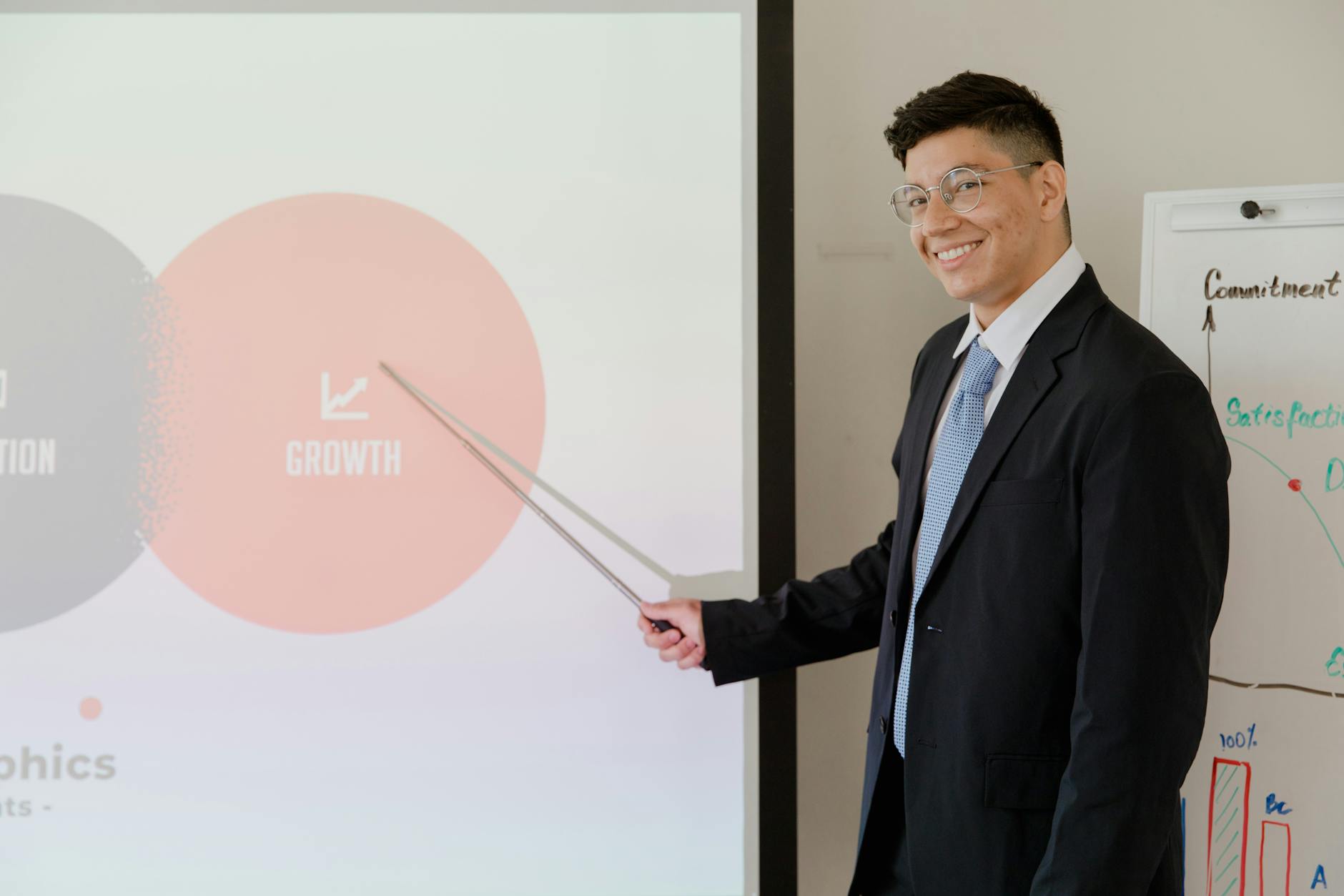 Professional presenting financial information to corporate audience in conference room