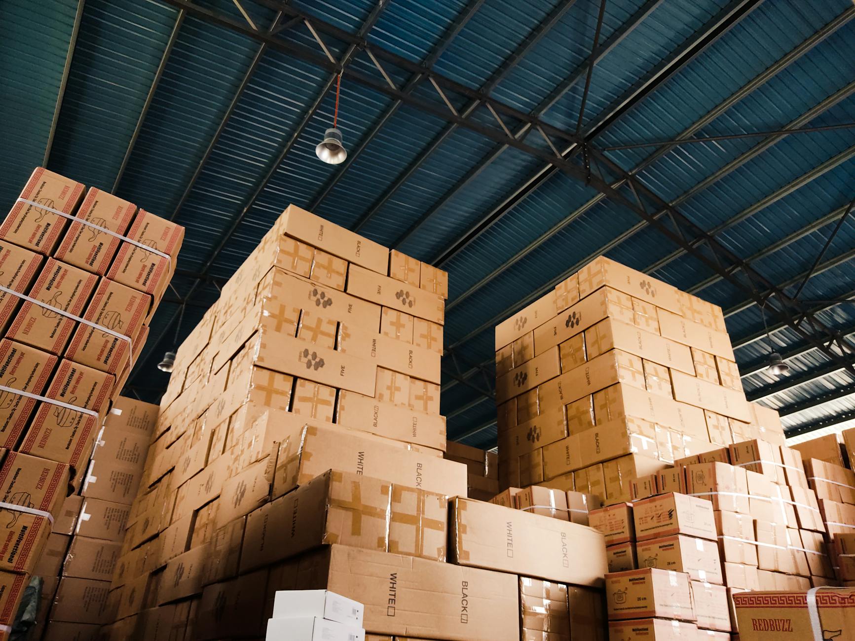 Large distribution warehouse interior with storage racks and logistics equipment
