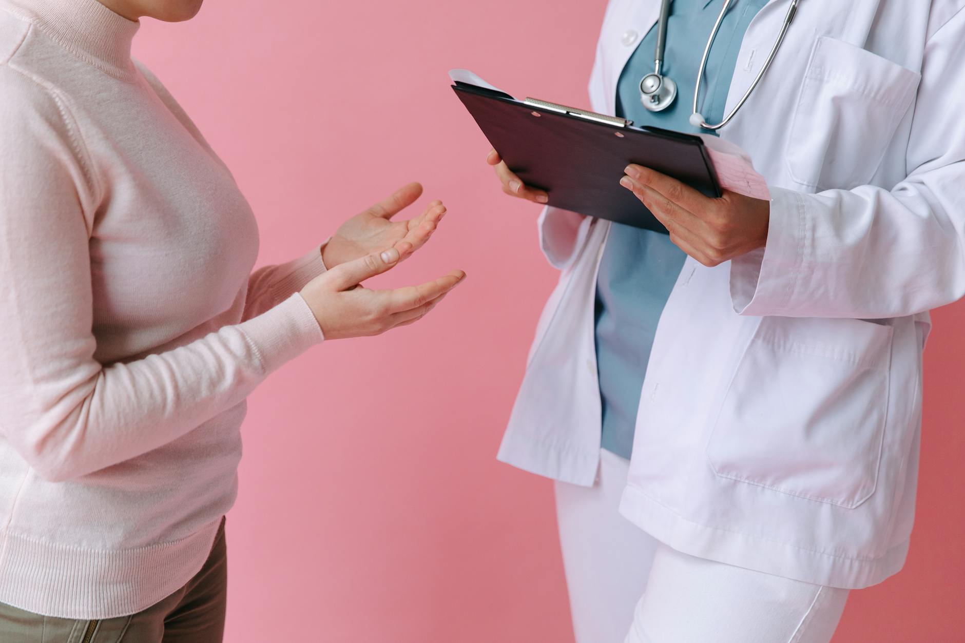 Healthcare professional conducting patient consultation in clinical setting
