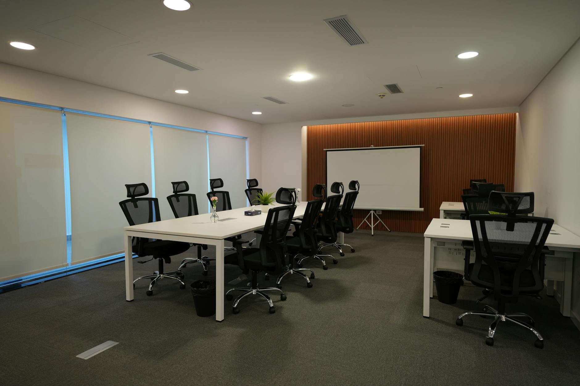 Professional coworking space with desks, chairs, and modern office amenities