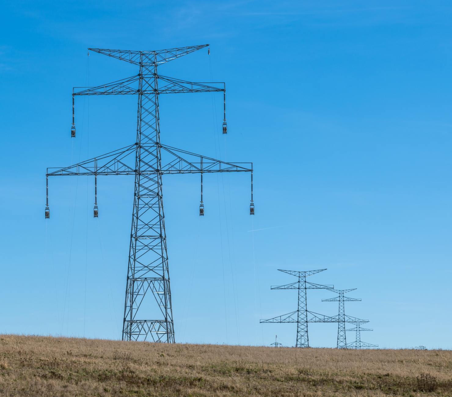 Power lines and electrical infrastructure representing energy grid and consumption patterns