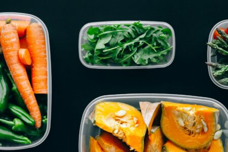 Fresh vegetables and cooking ingredients arranged for meal preparation