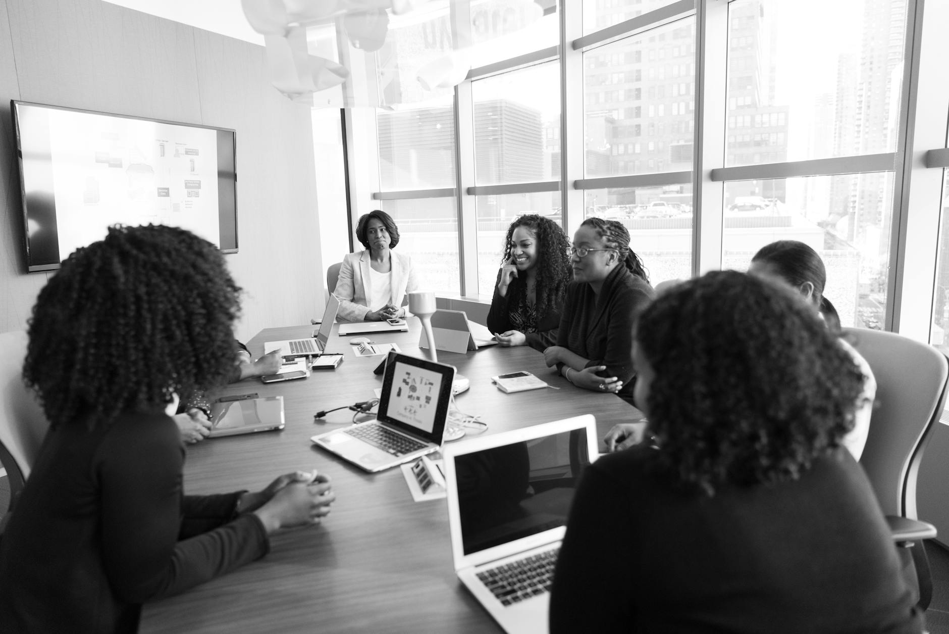 Business executives reviewing technology integration plans in conference room