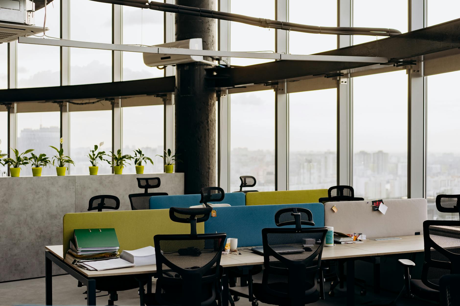 Spacious modern office interior with desks and natural lighting