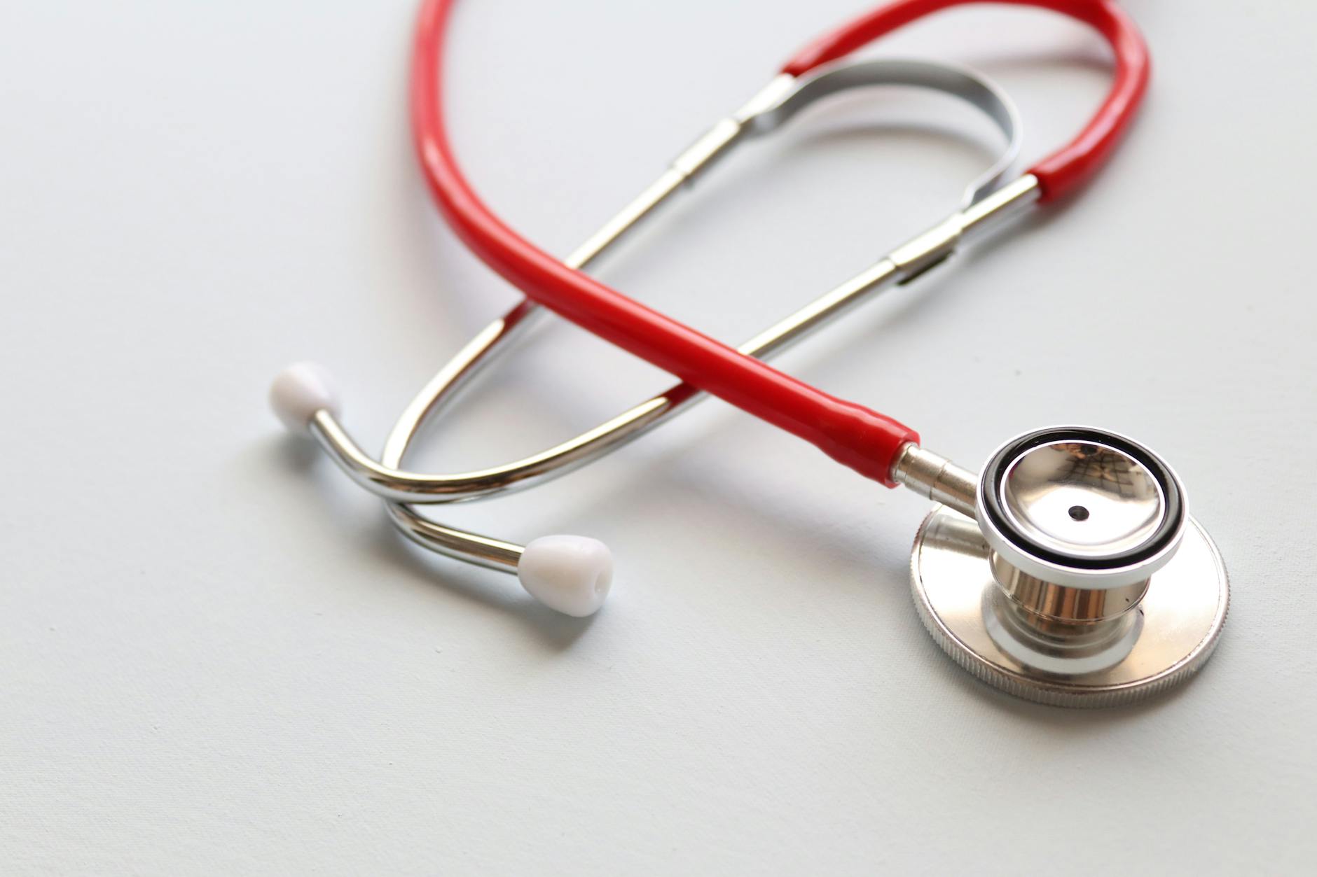 Medical stethoscope on white background symbolizing healthcare coverage and benefits