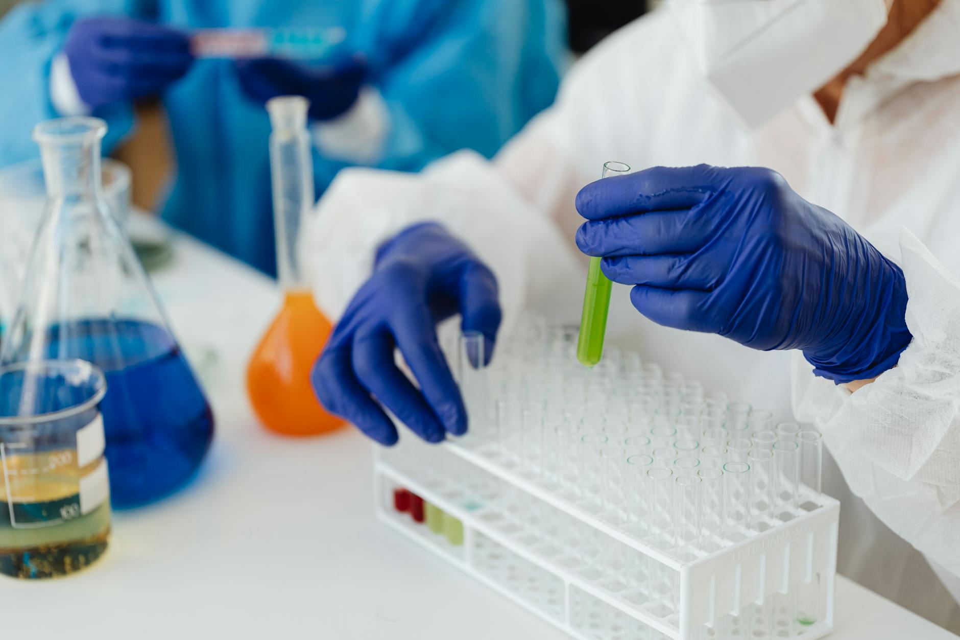 Scientists working with advanced laboratory equipment and testing samples