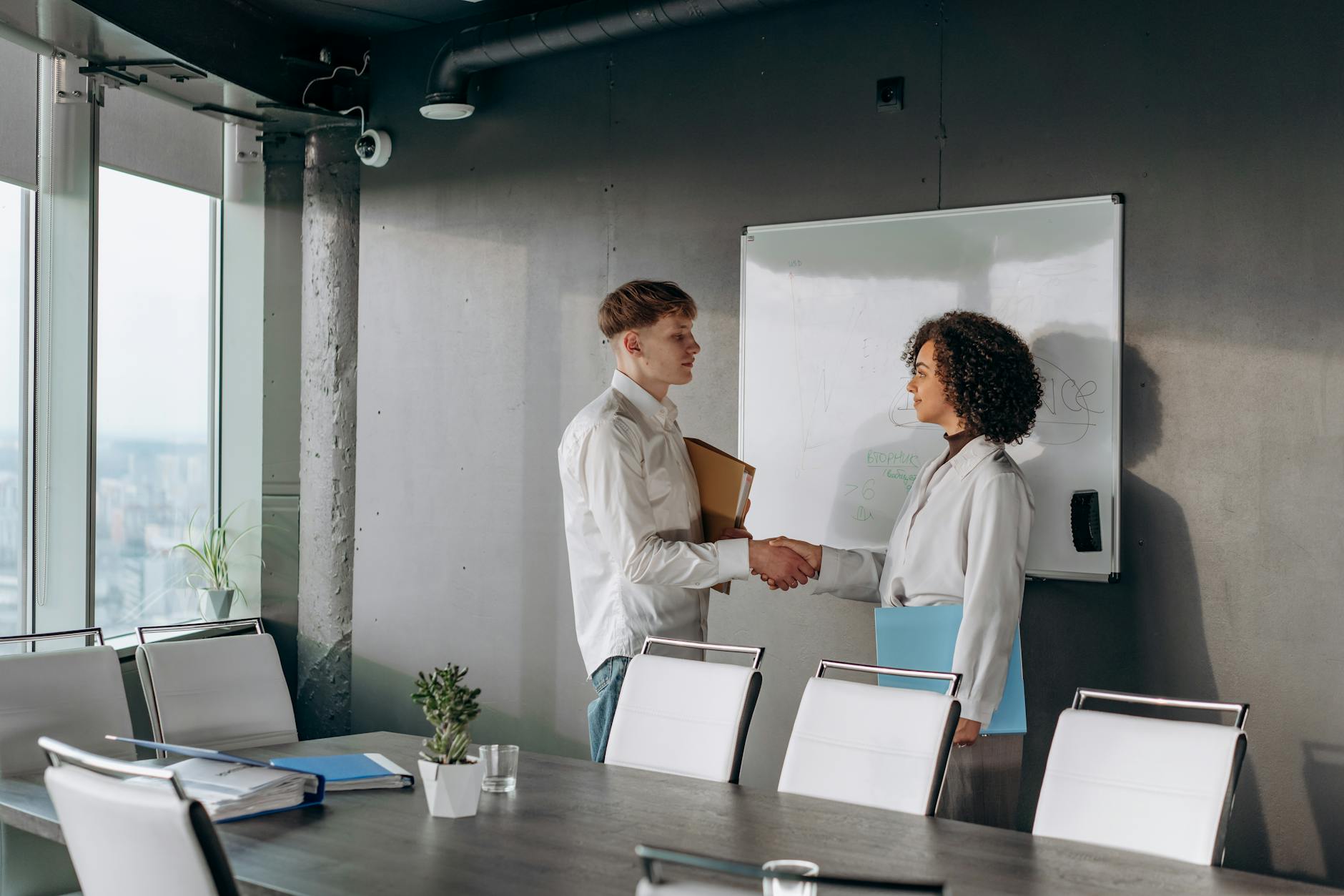 Professional handshake between business partners sealing investment agreement