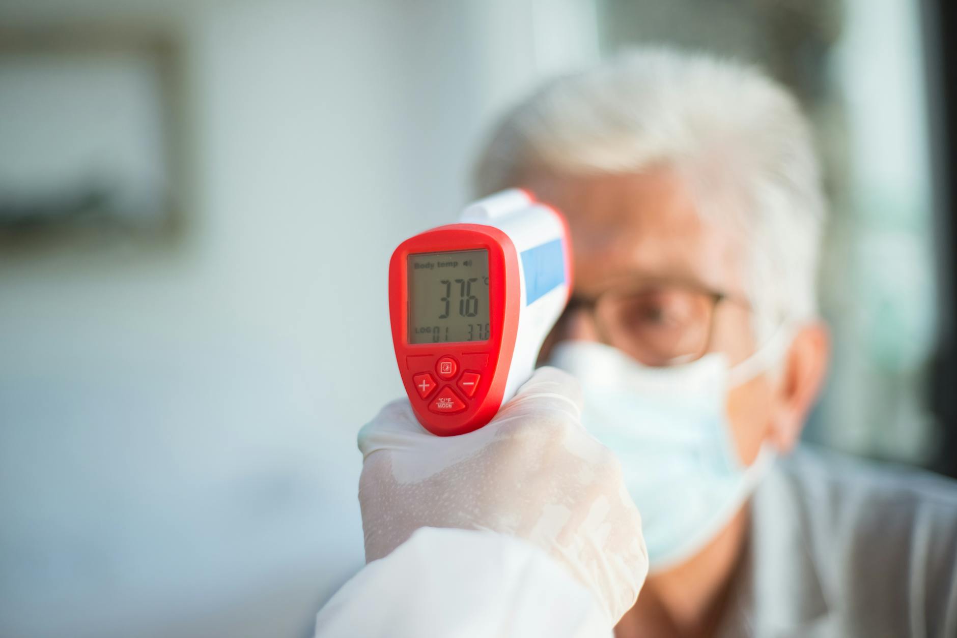 Professional conducting workplace health assessment with digital monitoring equipment