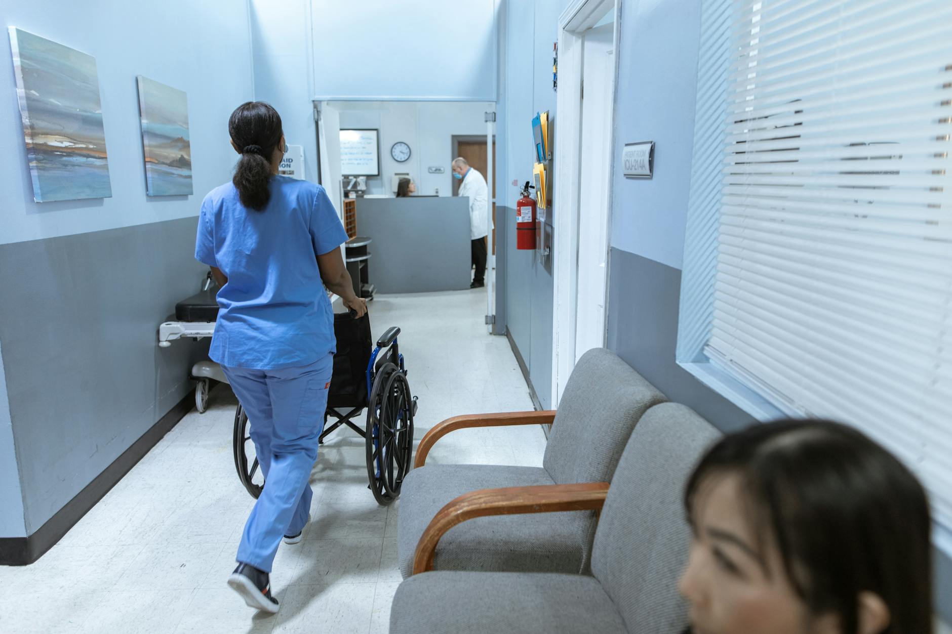 Bright modern hospital corridor with advanced medical equipment and accessible design elements