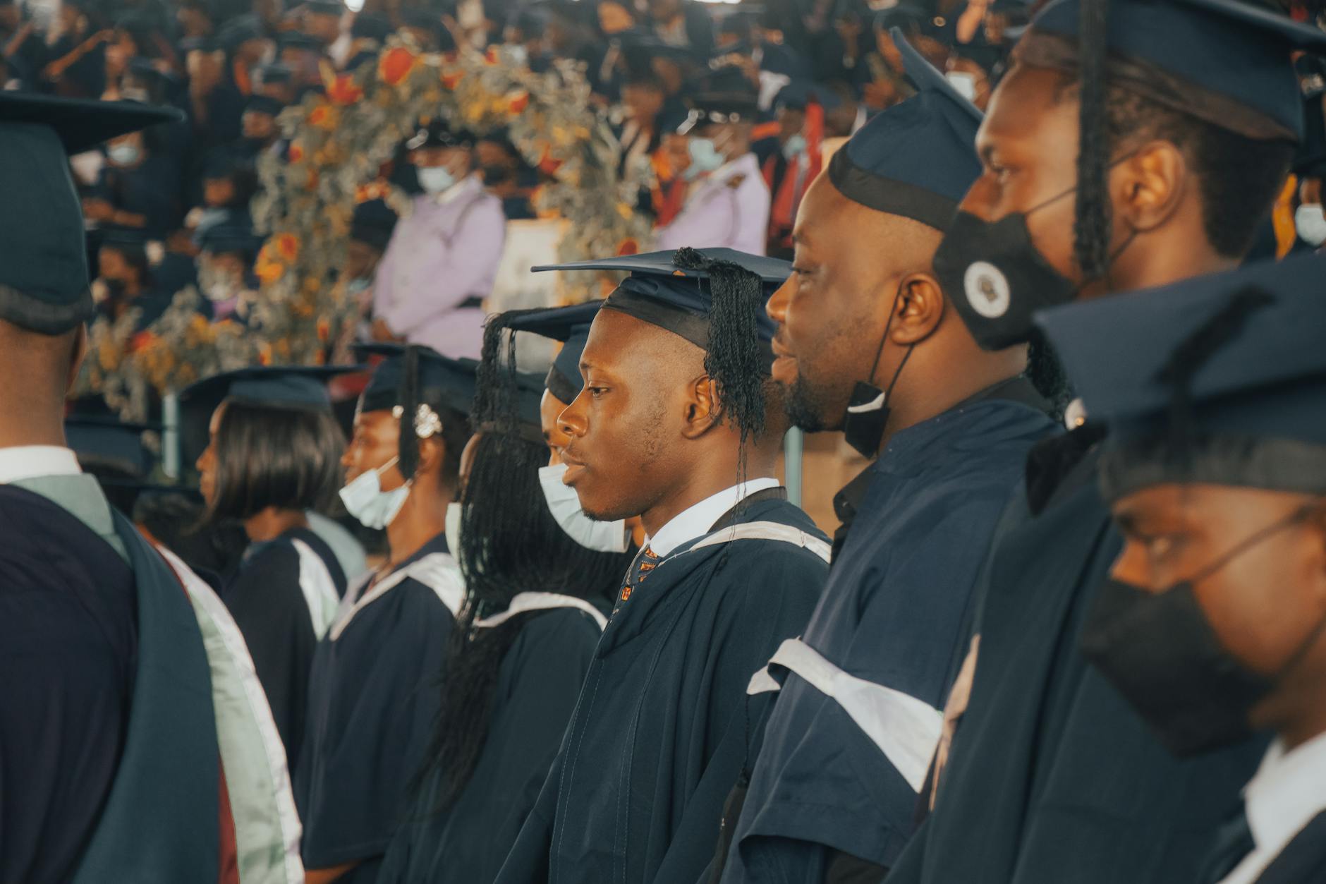 Graduation or completion ceremony with professionals receiving certificates