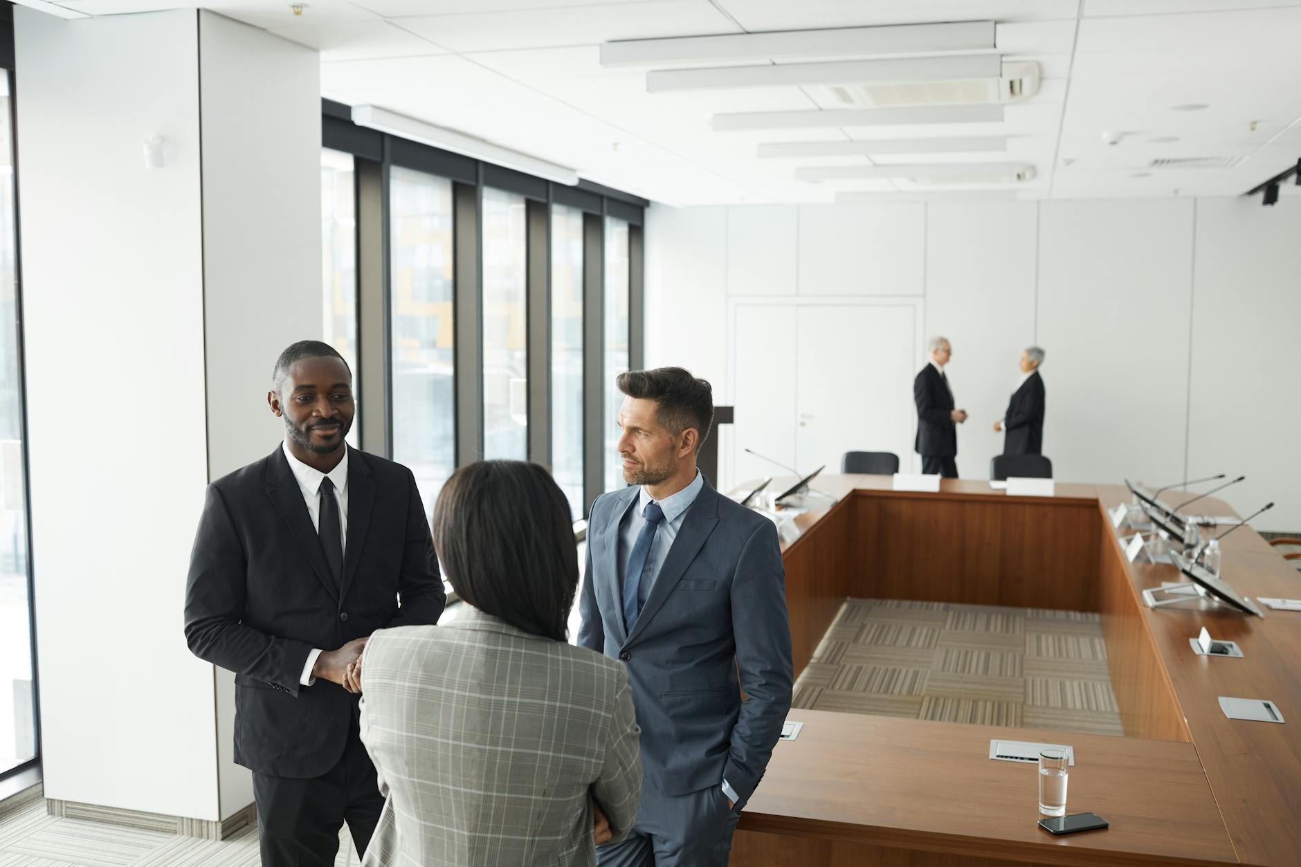 Corporate executives in business meeting discussing strategy documents