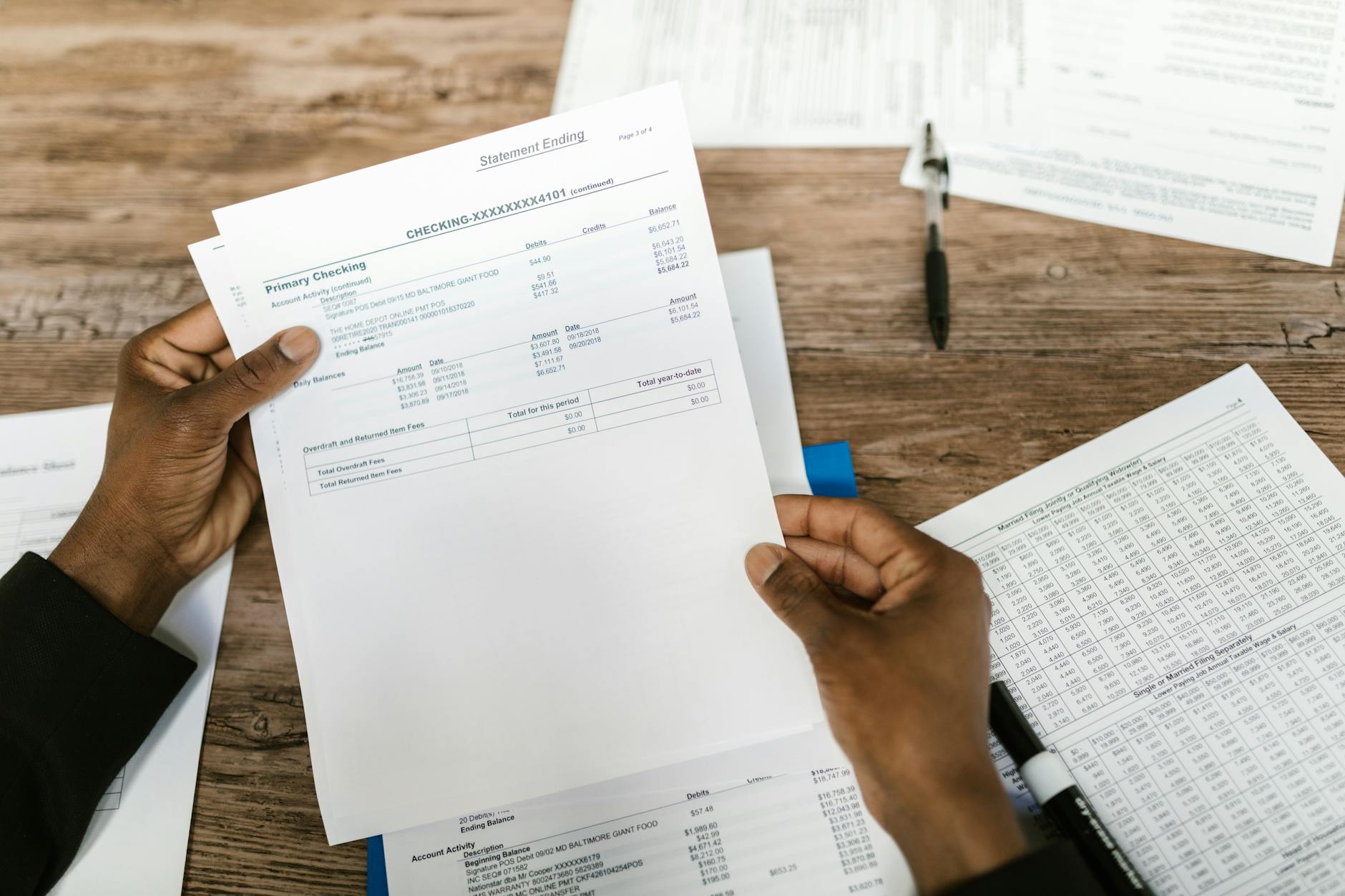 Financial planning documents and calculator showing mortgage calculations