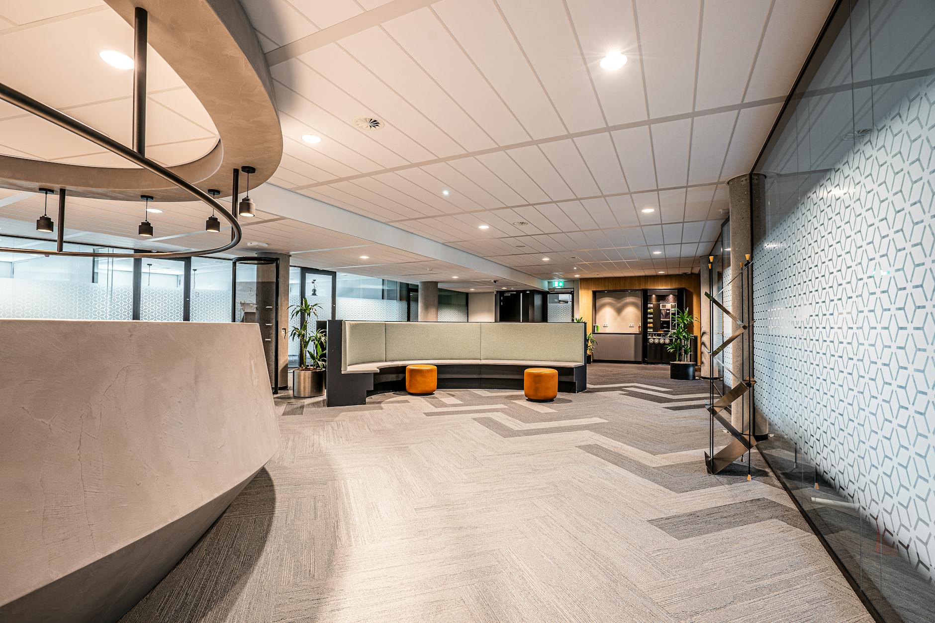 Modern bank branch interior with open lobby space and customer seating area